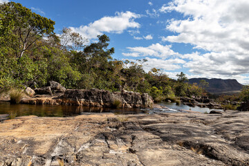 Rocks, stones and the river with the sky like a background