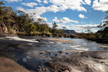 Rocks, stones and the river with the sky like a background