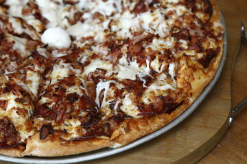 Closeup of specialty pizza with mozzarella ball in the center