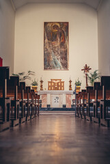 corridor with benches in the Catholic church. interior of the church. the concept of prayer and religious life