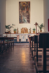 corridor with benches in the Catholic church. interior of the church. the concept of prayer and religious life