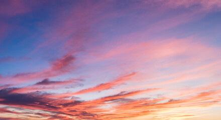 Inspiring rainbow colored clouds in a twilight sky