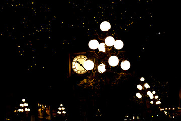 Gastown Steam Clock at night - Black background with Christmas lights