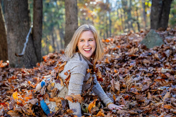 A Lovely Blonde Model Poses Outdoor While Enjoying The Fall Weather