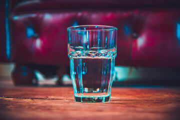 glass of water red leather 