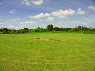 初秋の平日の除草された江戸川河川敷の野球場風景