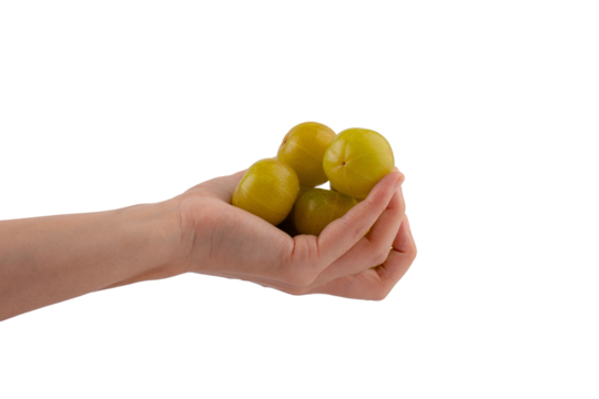 Hand and Ayurvedic Amla or Indian Gooseberry Juice, healthy diet on transparent background