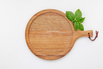 Pizza dough in wooden pizza platter set up on white wooden . Pizza tray on white wooden background flat lay and copy space.