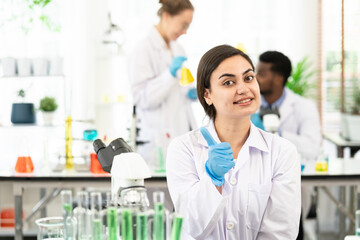 success happy news lab researcher doing thumbs up with medical gloves. happy and positive, thumb up doing excellent and approval sign.