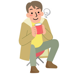 アウトドアで座って飲み物を飲む若い男性