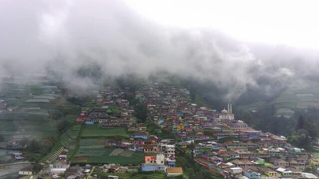 Aerial shot of Butuh village, Magelang, Indonesia also known as Nepal Van Java in foggy morning