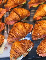 Catering table, beautifully decorated banquet table with variety of different food snacks, sandwiches, croissants and appetizers on party event or celebration, delicatessen setting, coffee break