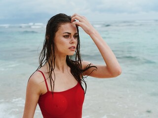 Beautiful woman on the beach by the sea 