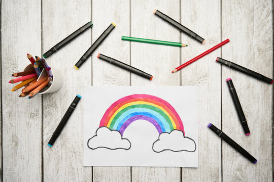 Colorful rainbow and highlighter marker on gray background
