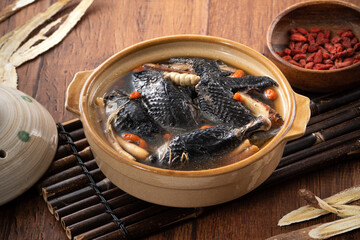 Fototapeta na wymiar Delicoius silky chicken soup with Chinese herbal medicine