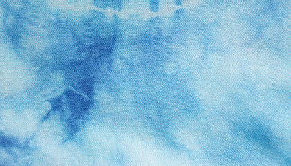 Close up of dye indigo fabric background in blue and white. Natural texture pattern for textile design.