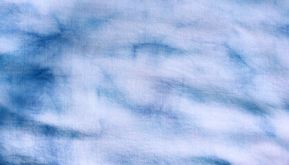 Close up of dye indigo fabric background in blue and white. Natural texture pattern for textile design.
