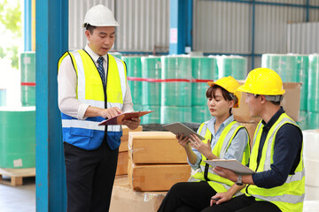 Group of technician engineer and businessman in protective uniform standing and discussing, researching, brainstorming and planning work together with tablet at industry manufacturing factory