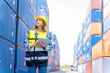 Women engineers in a container shipping company Consulting to check the order for the container that is responsible	
