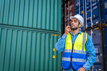 male engineers in a container shipping company Consulting to check the order for the container that is responsible	
