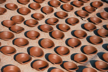 Traditional drying of clay bowls in the sun