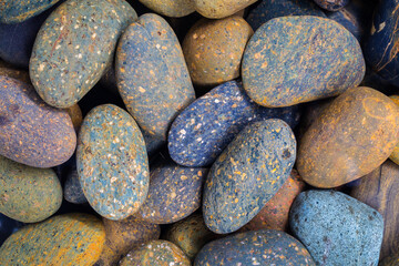 Colorful stone under the water. stone used for spa background or texture tile wall.