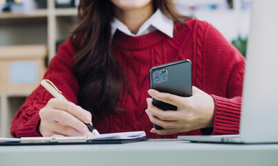 Businessman and team analyzing financial statement Finance task. with smart phone and laptop and tablet. Wealth management concept