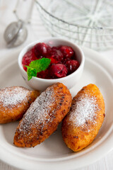 Fried patties with cherries and strawberries, homemade food