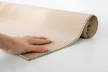 roll of corrugated cardboard isolated on white background for advertising and design