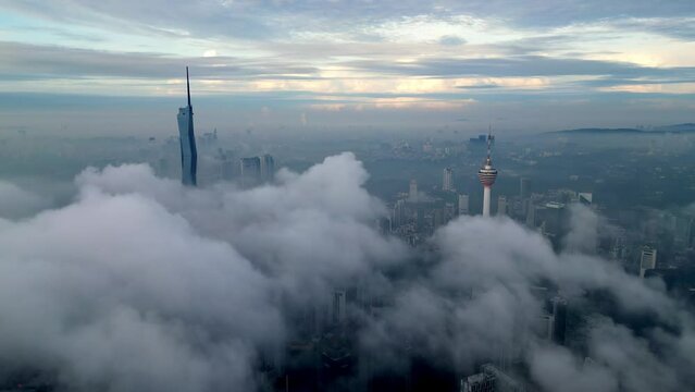 Morning misty morning at PNB 118 and KL tower. Aerial establishing shot