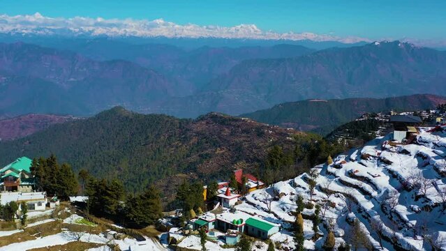 Mussoorie,Uttarakhand India- January 15 2022- Aerial winter landscape of trees and fields covered in snowfall . Snowfall in Mussoorie, Uttarakhand India. Aerial view of beautiful snow-covered