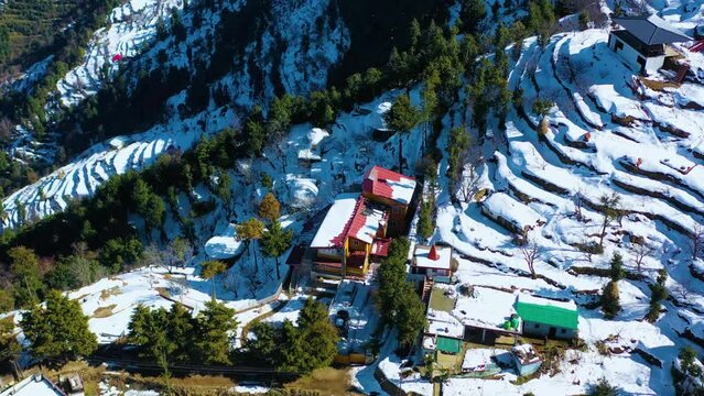 Mussoorie,Uttarakhand India- January 15 2022- Aerial winter landscape of trees and fields covered in snowfall . Snowfall in Mussoorie, Uttarakhand India. Aerial view of beautiful snow-covered