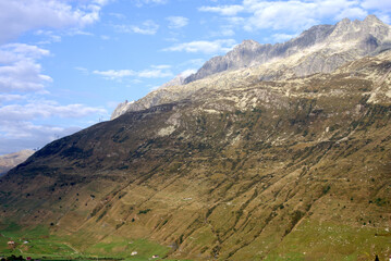 Mountain panorama at Swiss mountain pass Oberalppass on a sunny late summer morning. Photo taken September 5th, 2022, Oberalp Pass, Switzerland.