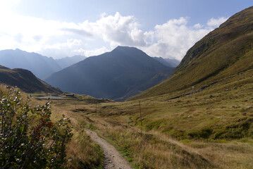 Mountain panorama at Swiss mountain pass Oberalppass on a sunny late summer morning. Photo taken September 5th, 2022, Oberalp Pass, Switzerland.