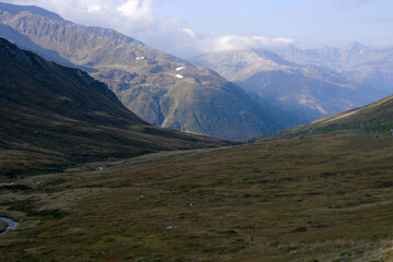 Mountain panorama at Swiss mountain pass Oberalppass on a sunny late summer morning. Photo taken...