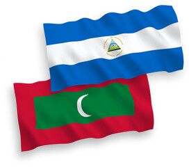 Naklejka premium National vector fabric wave flags of Nicaragua and Maldives isolated on white background. 1 to 2 proportion.