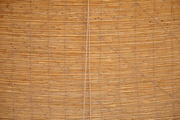 Brown bamboo blinds texture and seamless background. Bamboo stick straw mat texture.