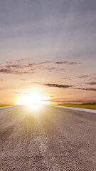 Asphalt road with green grass