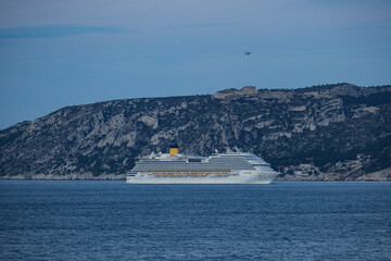 Costa cruiseship or cruise ship liner Diadema arrival into Marseille Provence port during sunrise twilight blue hour Mediterranean cruise dream vacation	