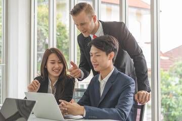 Group of office workers brainstorming in the meeting.