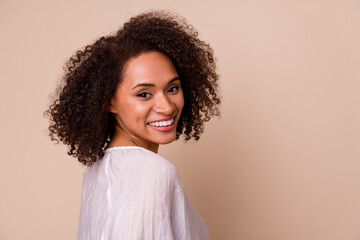 Profile portrait of positive gorgeous person toothy beaming smile empty space isolated on beige color background