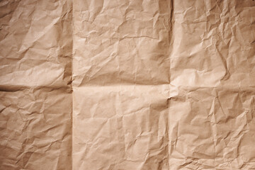 Crumpled brown kraft paper with folded folds. Background texture.