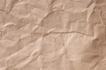 Crumpled brown recycled wrapping paper. Background texture.
