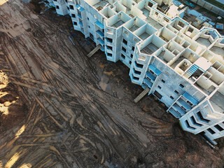 The initial stage of construction of a prefabricated reinforced concrete house. Assembly of a panel...
