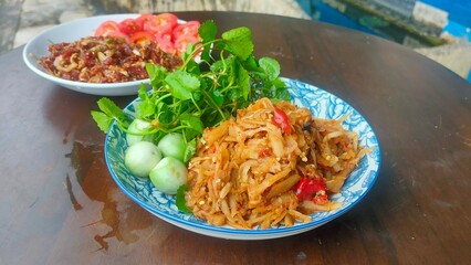Thai Food, Isaan Food Dishes, Spicy Bamboo Shoot Stir Fried with vegetables. Stri fried pre boiled bamboo shoot and minced pork