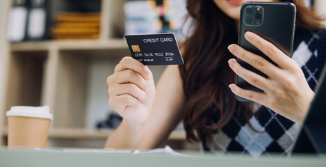 Businessman hand using laptop compter with holding cradit card payments online shopping or business.