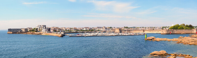 Fototapeta na wymiar Panoramic view of the bay of Concarneau and the ramparts protecting the Ville Close de Concarneau, in Brittany in the far west of France