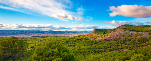 Fototapeta na wymiar Aragon panoramic landscape view- orange mountain, forest and clouds ( sierra armantes, Calatayud)