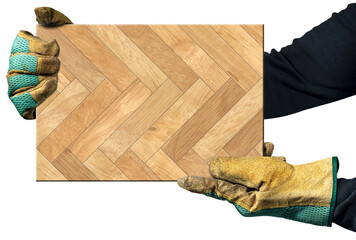 Manual worker with protective work gloves, holding a herringbone wood parquet sample, isolated on...
