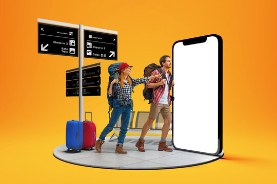 At airport. Happy young couple, smiling man and woman going to summer vacation trip using 3d model of phone isolated on orange background.